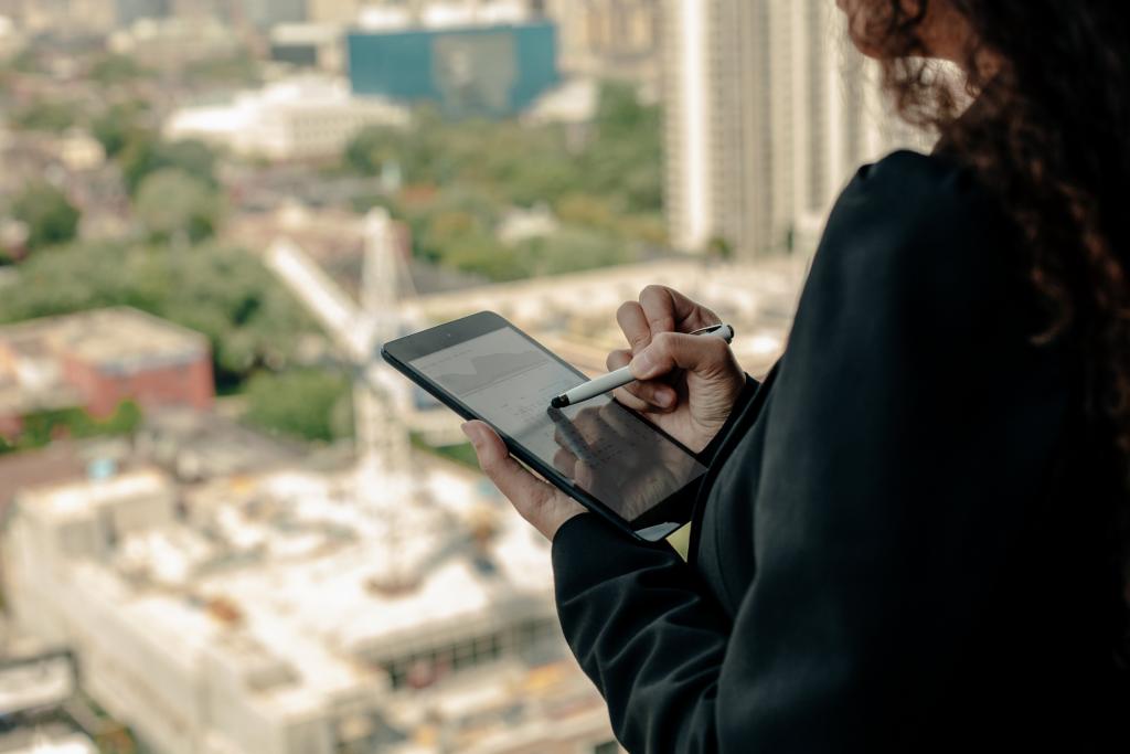 woman using ipad with stylus highrise office 1024x683 1