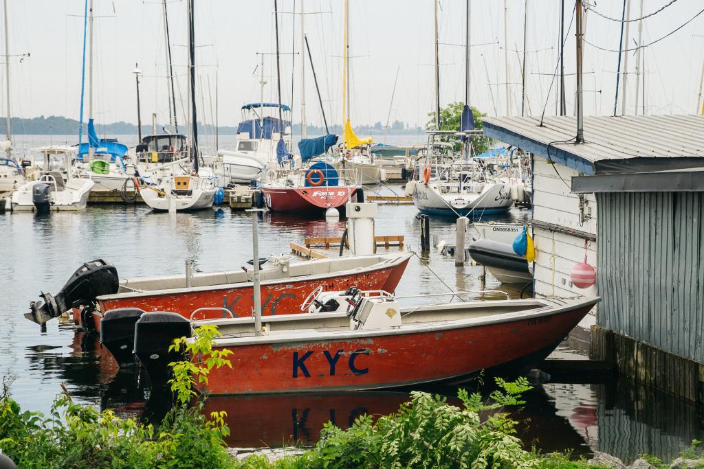 small pair of boats docked by boathouse 1024x683 1