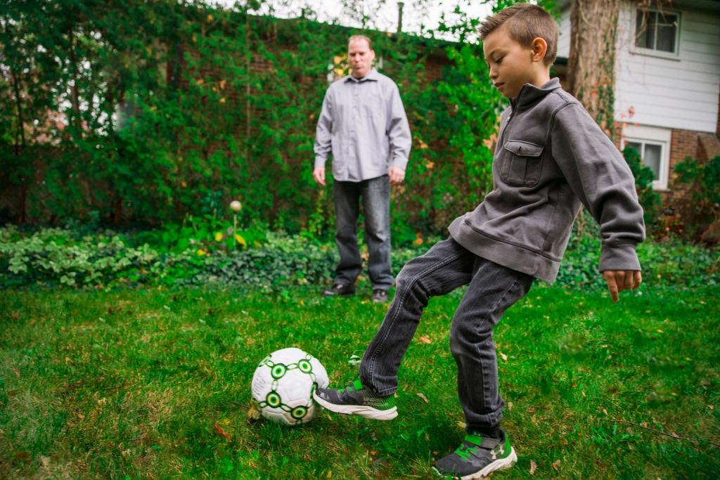 father and son playing soccer 1024x683 1