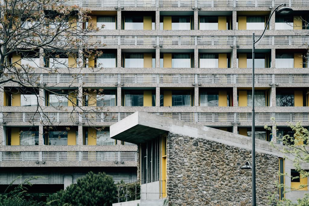 yellow and beige apartment building and balconies 1024x683 1