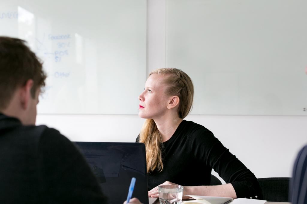 woman in office looks out window 1024x683 1