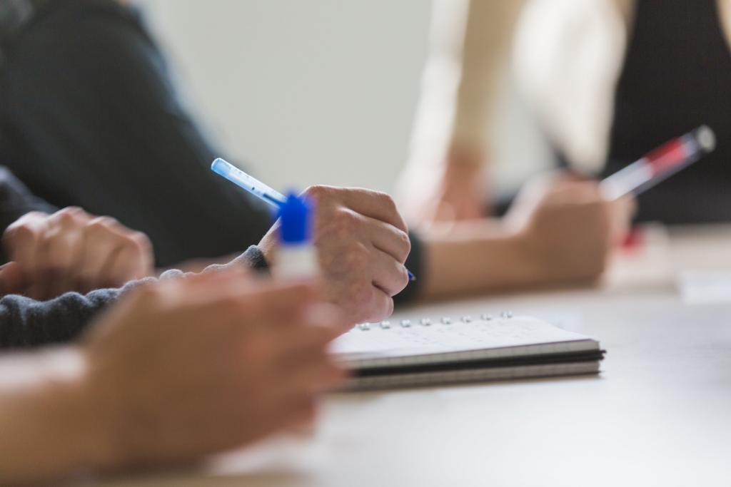 team taking meeting notes 1024x683 1